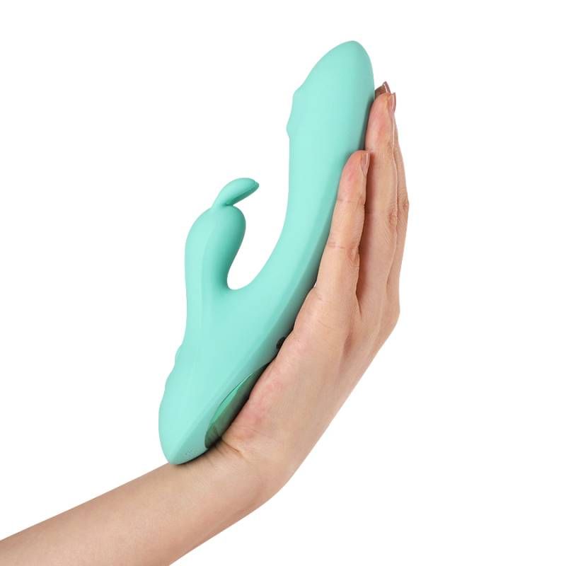 G-Spot and clitoral vibrator held in a hand, showcasing ergonomic design and soft silicone material.