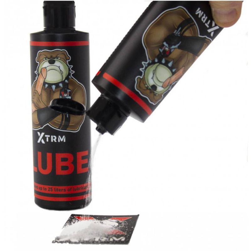 XTRM Lube Powder 225gm (25 Litres) being poured from bottle onto packet.