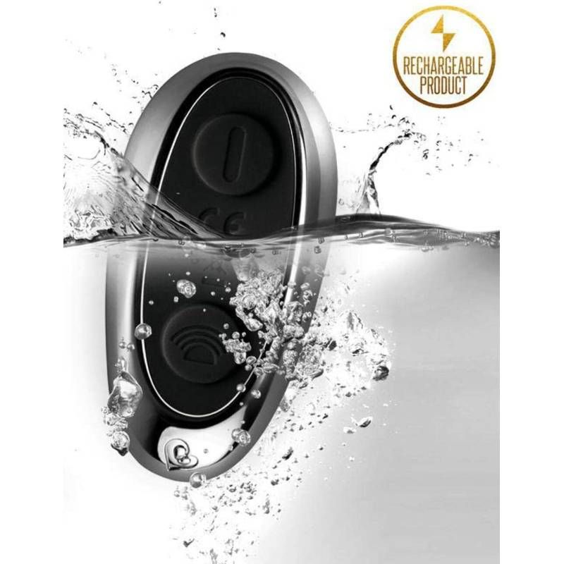 The Vibe anal cock and ball stimulator submerged in water, showcasing its rechargeable feature and sleek design.
