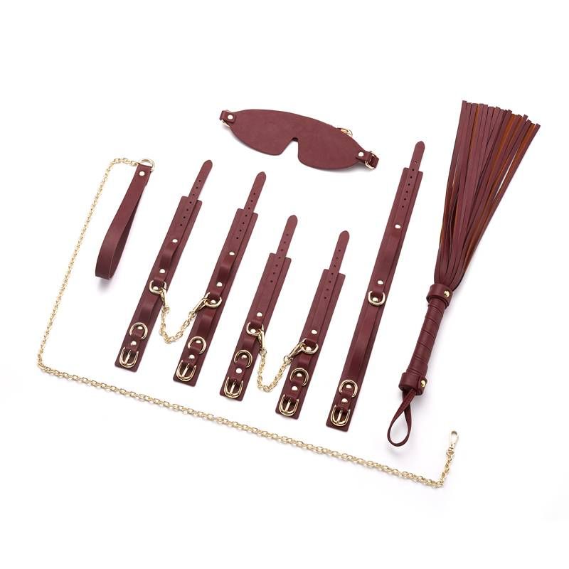 8 Pc Deluxe Bondage Play Kit featuring burgundy faux leather restraints and gold metal accents.