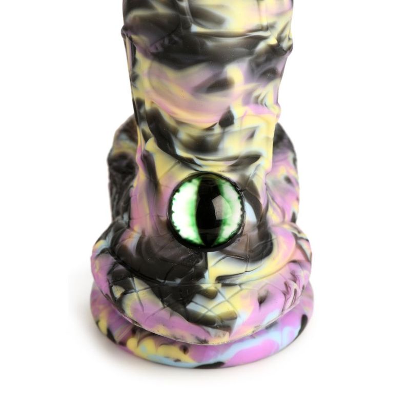 Close-up of a Creature Cocks cyclops monster silicone dildo featuring a colorful textured shaft and an eye at the base.