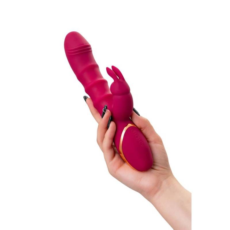 JOS Tenty Rabbit Vibrator with Moving Shaft Rings held in hand, designed for dual stimulation and made of velvety silicone.