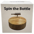 Spin the Bottle Game retail packaging featuring a wooden spinning base and metal bottle for fun party activities.
