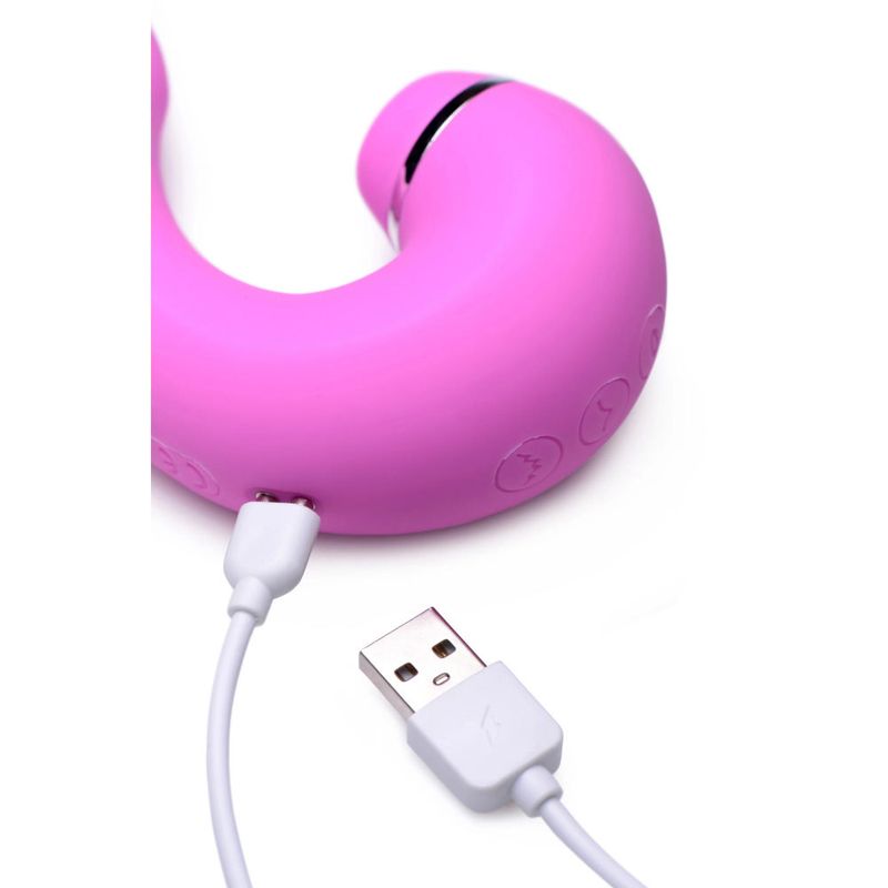 Close-up of Shegasm 5 Star G-spot vibrator with suction, showing charging cable and buttons.