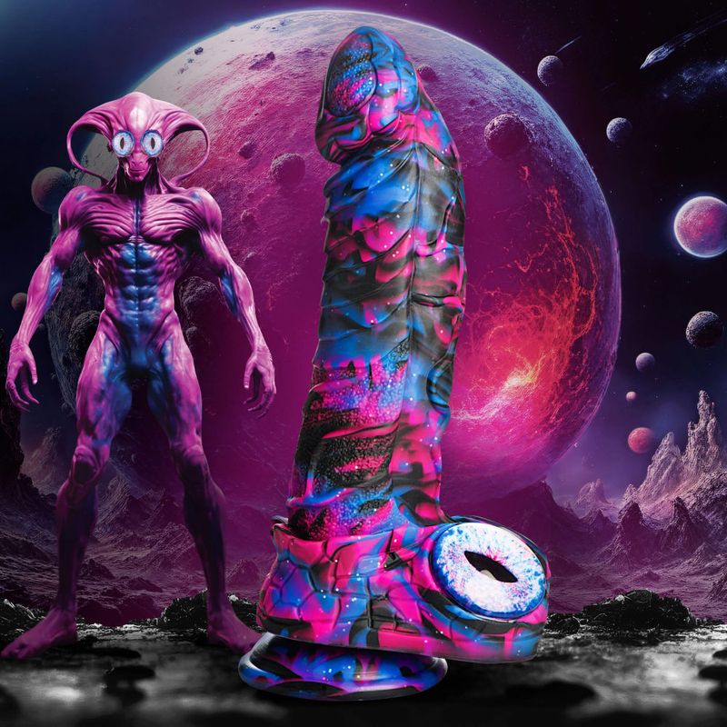 Alienoid silicone dildo next to an alien figure against a cosmic background.