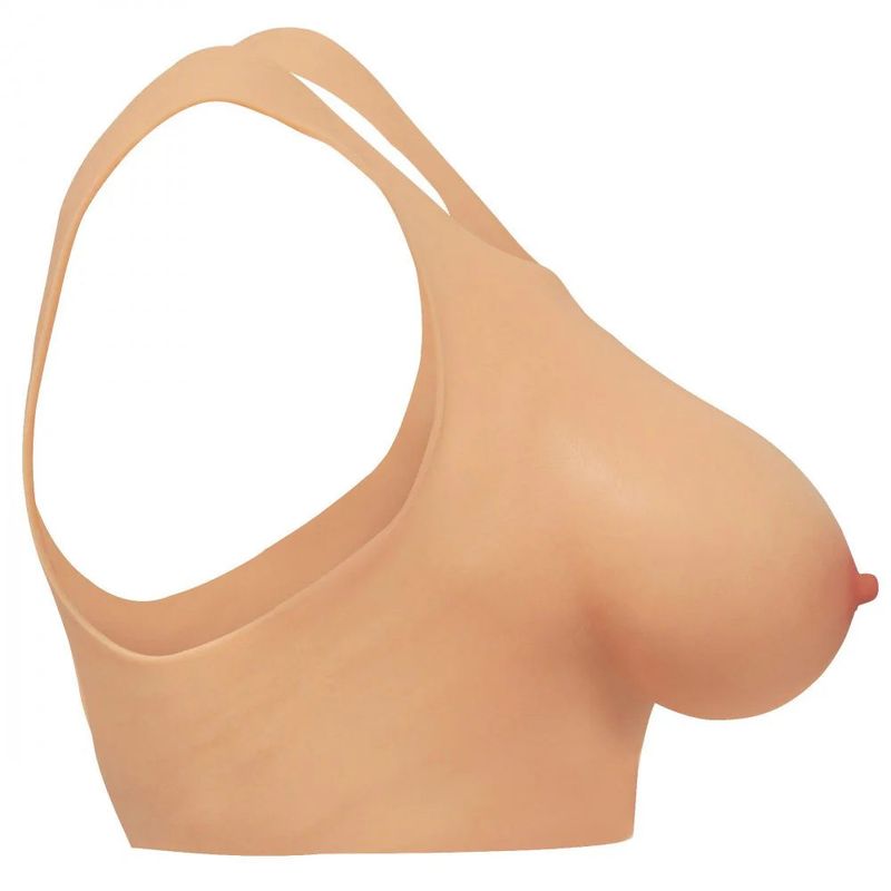 Side view of D cup silicone breasts showing realistic detail and smooth surface.