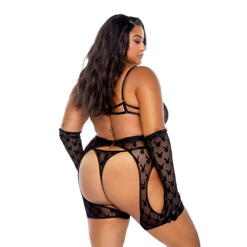 Playboy Flocked Bunny Chaps 3 Pc Set  Black featuring a model showcasing the back view of the stunning lingerie set.