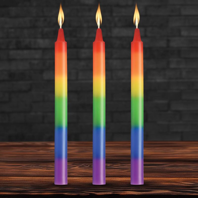 Pride Rainbow Drip Candles in vibrant colors with flames, perfect for intimate scenes and temperature play.