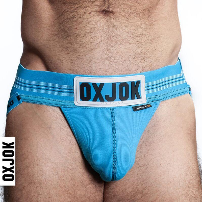 Oxballs Slingjock Upthrust Slider-Strap Jock Black Iron shown in blue color, showcasing the comfortable fit and stylish design.
