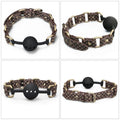 Rebellion Reign Ball Gag made of brown PU leather, featuring a breathable silicone ball for luxury bondage ball gag experience.