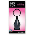 Butt Plug Keychain displayed on packaging with a playful design, perfect for a fun accessory collection.