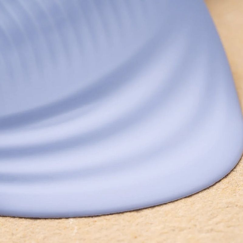 Close-up of the NIYA 5 silicone rechargeable massager, showcasing its smooth, flexible pad design.
