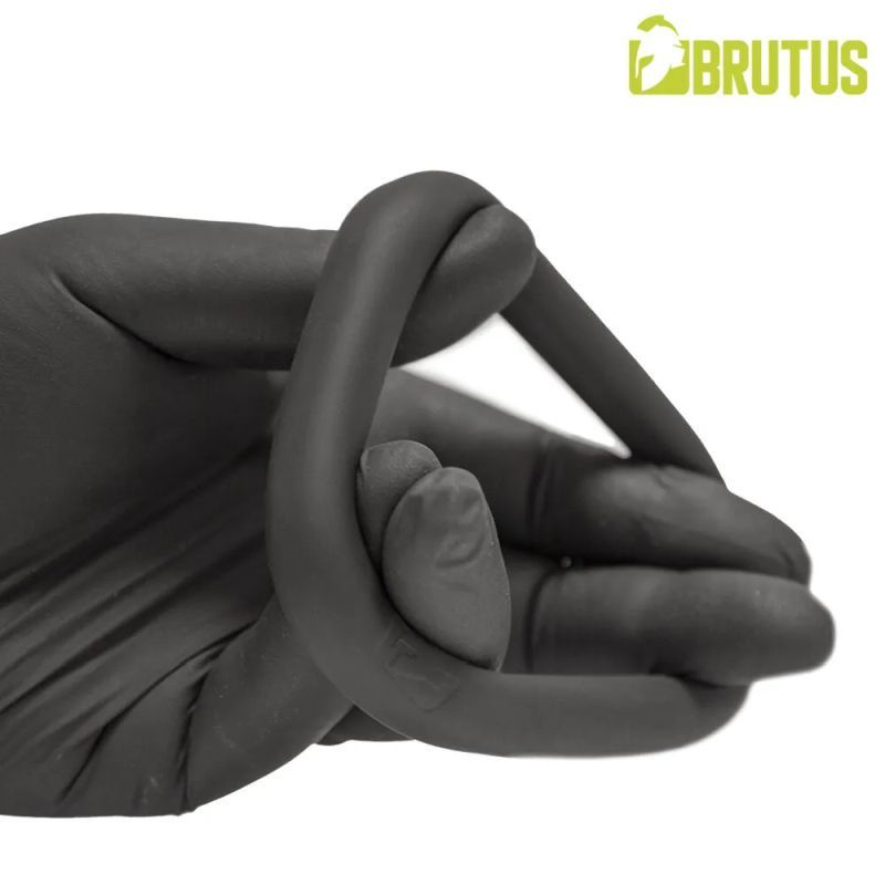 Brutus Hypersoft Silicone Ergo Cockring held in hand, showcasing its flexible and ergonomic design.