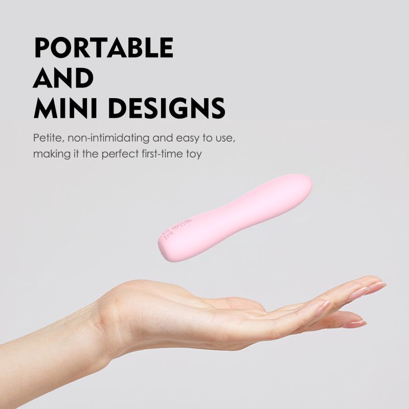 Portable pink silicone bullet massager being held in hand, showcasing mini design for easy use and first-time pleasure.