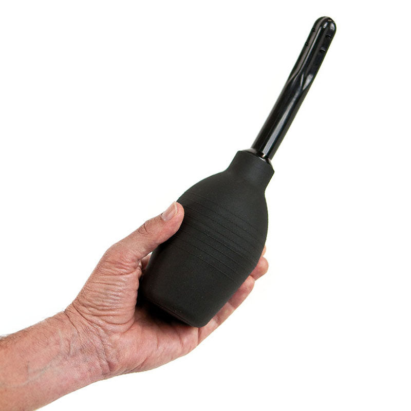EZ anal douche held in hand, designed for gentle cleansing and preparation for anal play.