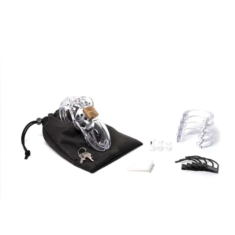 CB-3000 chastity cage kit with a transparent cock cage, key, and additional components for enhanced adult play.