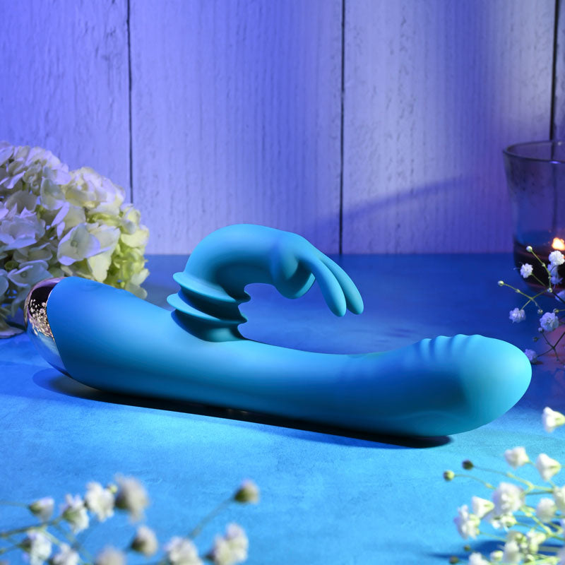 Adam & Eve SHIMMY & SHAKE VELVET RABBIT - 22.4 cm USB Rechargeable Rabbit Vibrator in a serene setting.