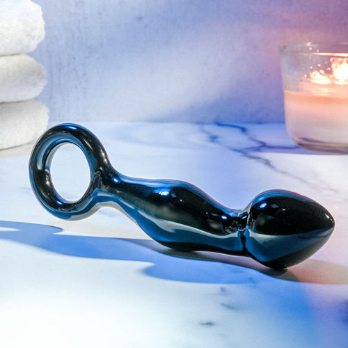 Glass prostate massager featuring a sleek design and curved shaft for optimal stimulation.
