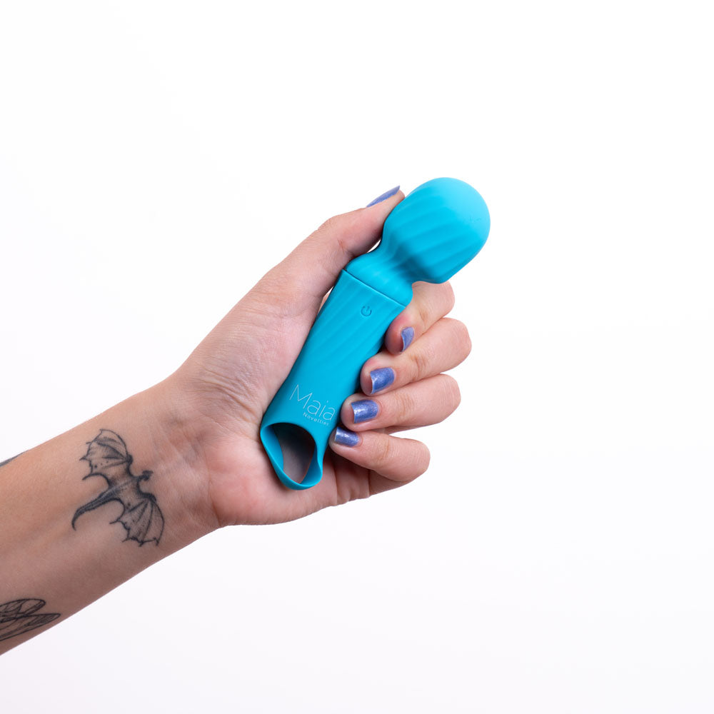 Maia DOLLY -  -  12.7 cm USB Rechargeable Massage Wand held in hand, showcasing its glossy blue silicone design.