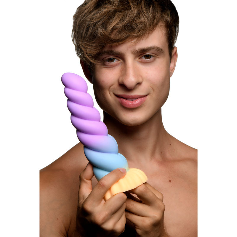 Creature Cocks Mystique Silicone Unicorn Dildo - 21 cm Fantasy Dildo held by a smiling individual showcasing its colorful design.