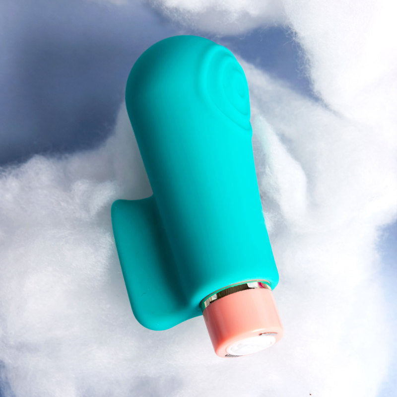 Aria Sensual AF - Teal USB Rechargeable Stimulator resting on soft clouds, showcasing its sleek design.
