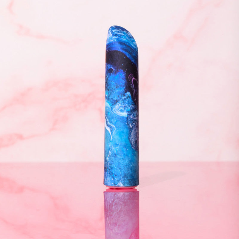 Limited Addiction Mesmerize - Power Vibe - Azure 10.2 cm USB Rechargeable Bullet on a pink background.