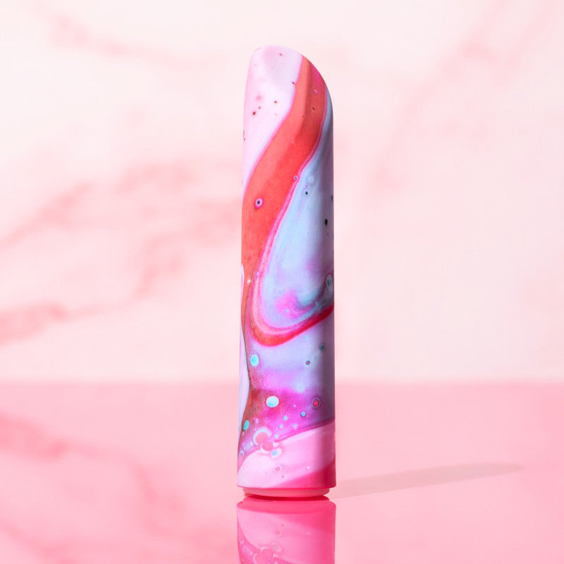 Limited Addiction Fascinate - Power Vibe - Peach 10.2 cm USB Rechargeable Bullet on pink background.