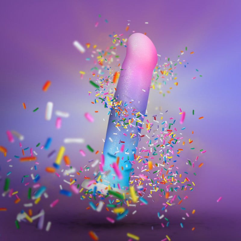 Avant - D17 - Lucky - Rainbow 20.3 cm Dong with colorful sprinkles against a soft purple background.