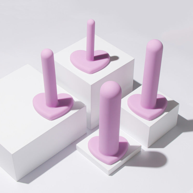 Wellness - Dilator Kit -  Vaginal Dilators - Set of 4 Sizes displayed on white pedestals.