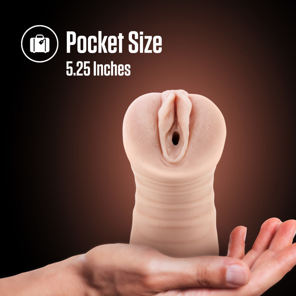EnLust - Ayumi - Vibrating Vagina Stroker in hand, showcasing pocket size of 5.25 inches, perfect for discreet pleasure.