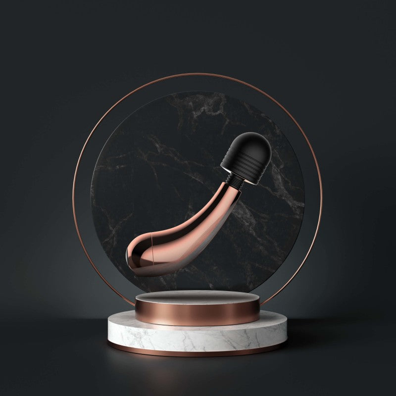 Lush Callie - USB Rechargeable Mini Massager Wand displayed elegantly with rose gold accents on a marble base.