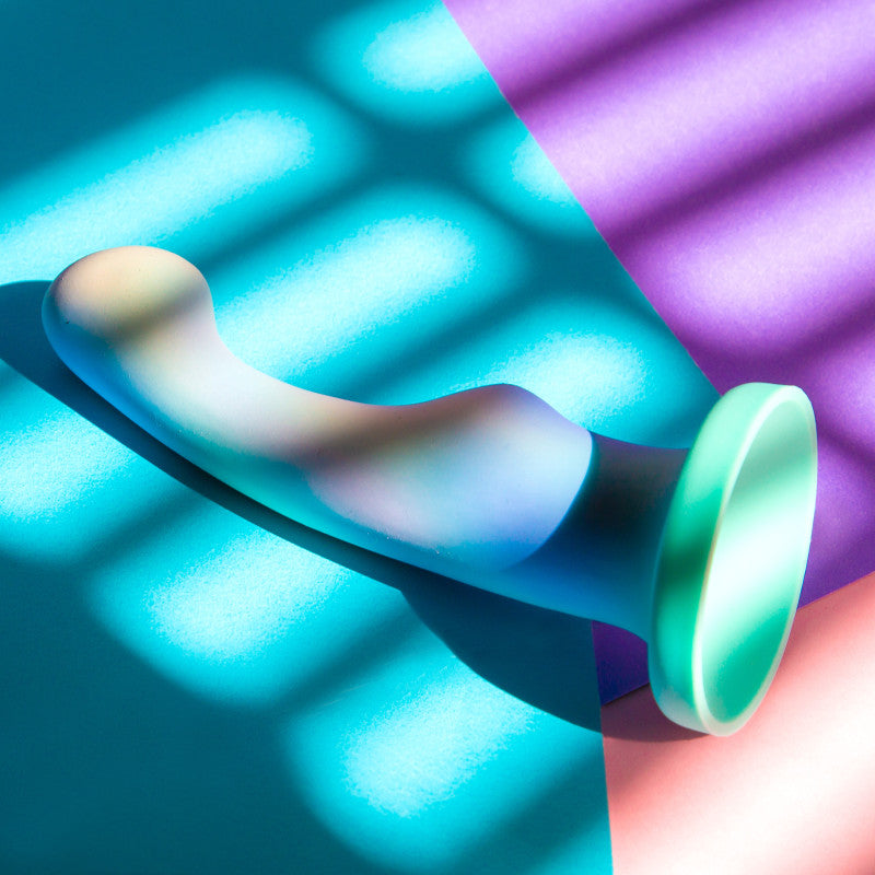 Avant Opal Dreams - Aqua - 15.2 cm Dildo showcasing elegant curves under colorful lighting.