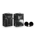 Noir Pom Adjustable Nipple Clamps - Black Furry Nipple Clamps packaging display with fluffy clamps.