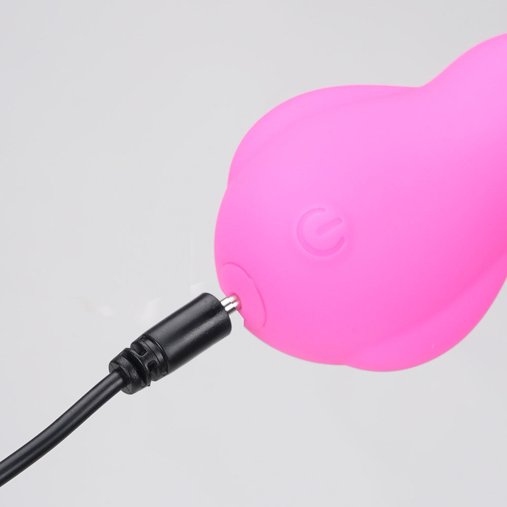 Maia BRI -  -  9 cm USB Rechargeable Vibrating Bunny Bullet with charging cable connected.