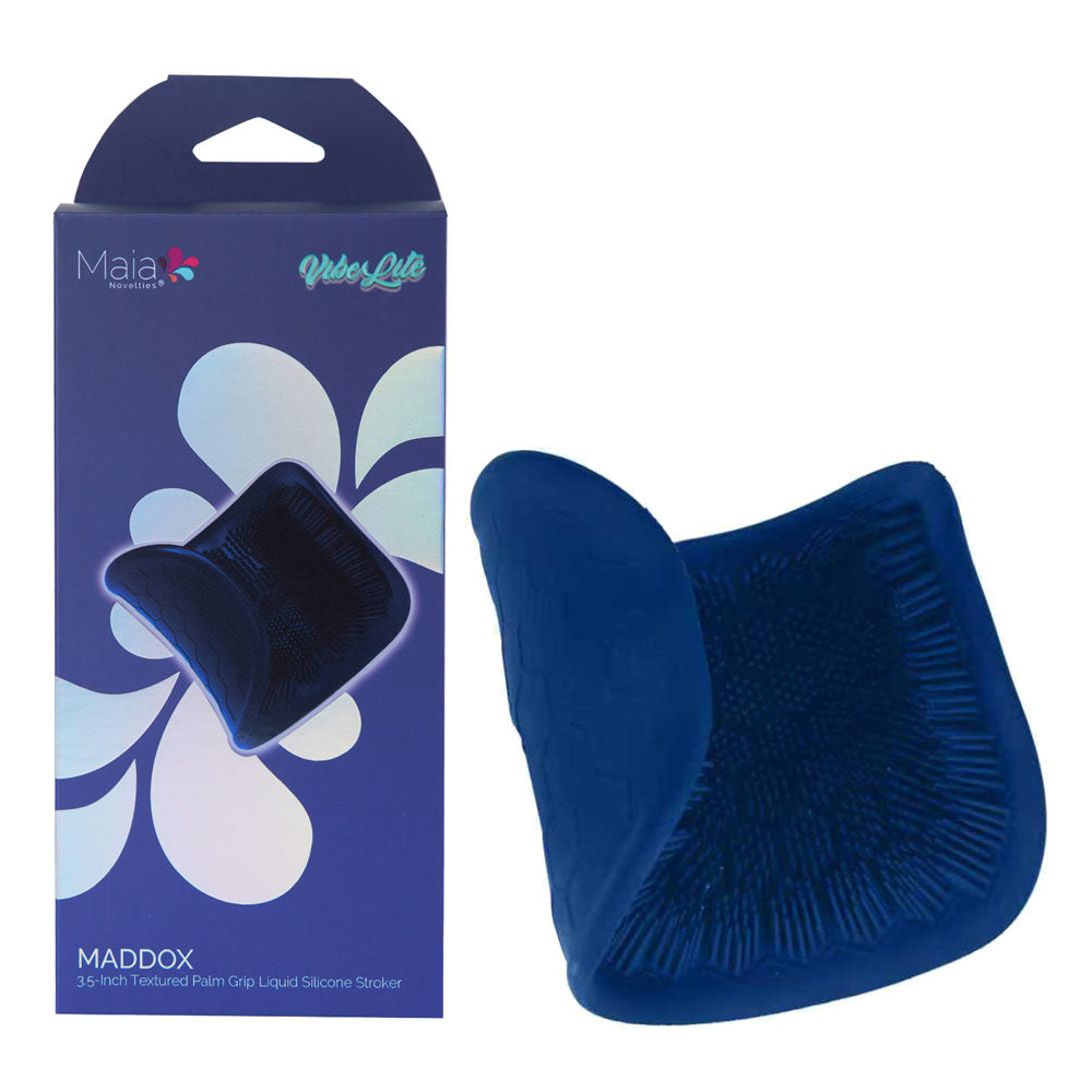 Maia MADDOX - Textured Stroker Sleeve next to its packaging, showcasing its unique design and texture.