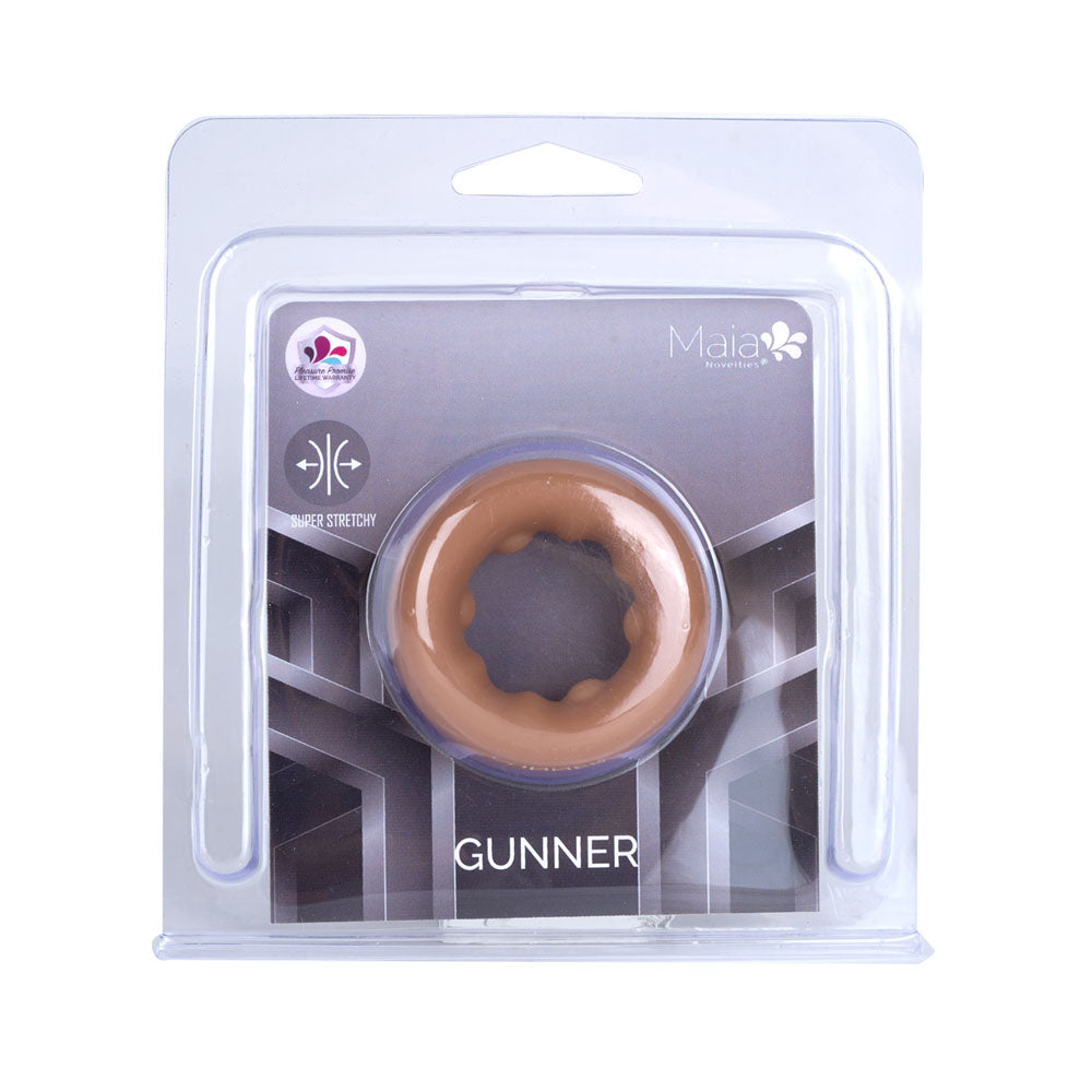 Maia GUNNER - Caramel - Tan Brown Cock Ring in packaging, highlighting its stretchy design and intimate essentials features.