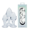 Clarity - Utopian Trinity -  Glass Butt Plugs - Set of 3 Sizes displayed with elegant packaging.
