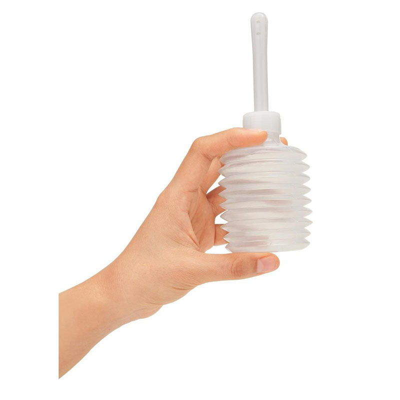 CleanScene 4 Piece Travel Bulb Douche Set - 90 ml Capacity with Bonus 150 ml Travel Douche held in hand.
