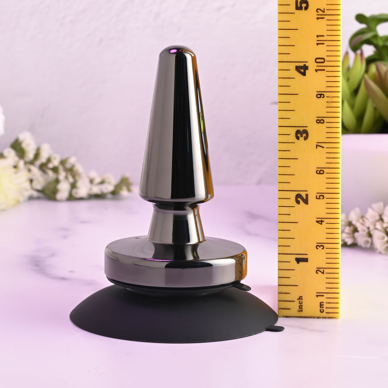 Evolved BEGINNER METAL PLUG - Black 11.2 cm USB Rechargeable Vibrating Butt Plug with a measuring tape for size reference.