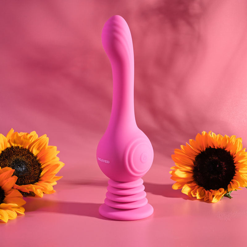 Evolved GYRO VIBE - 24.8 cm USB Rechargeable Super Vibrator surrounded by sunflowers on a pink background.