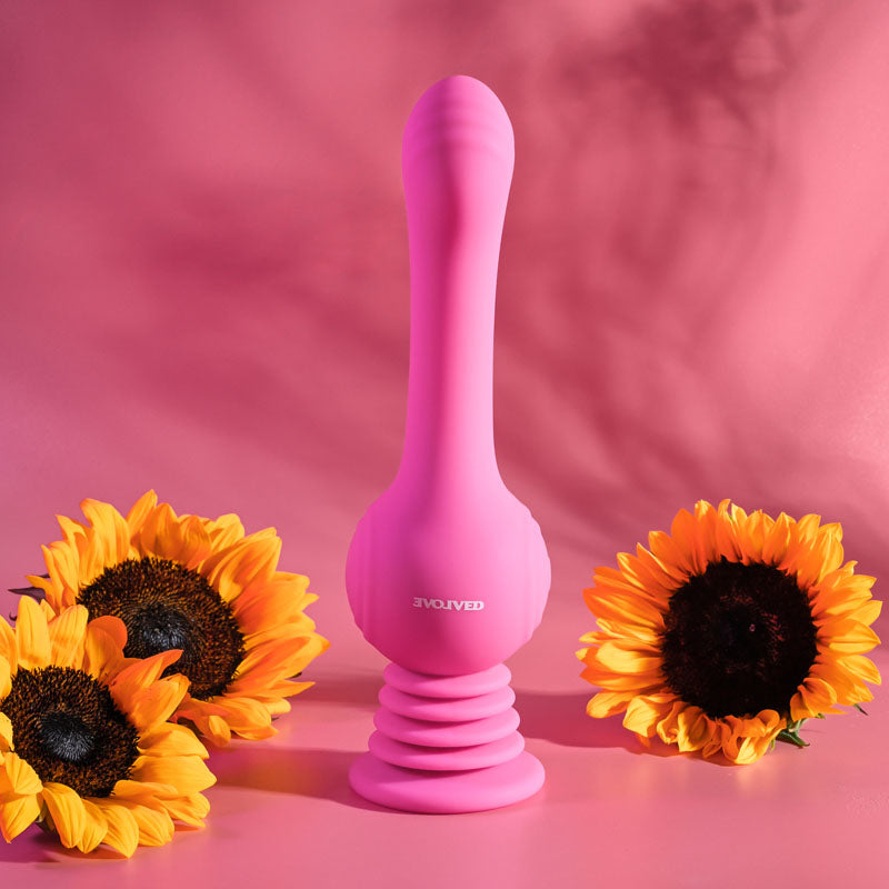 Evolved GYRO VIBE - 24.8 cm USB Rechargeable Super Vibrator surrounded by sunflowers on a pink background.