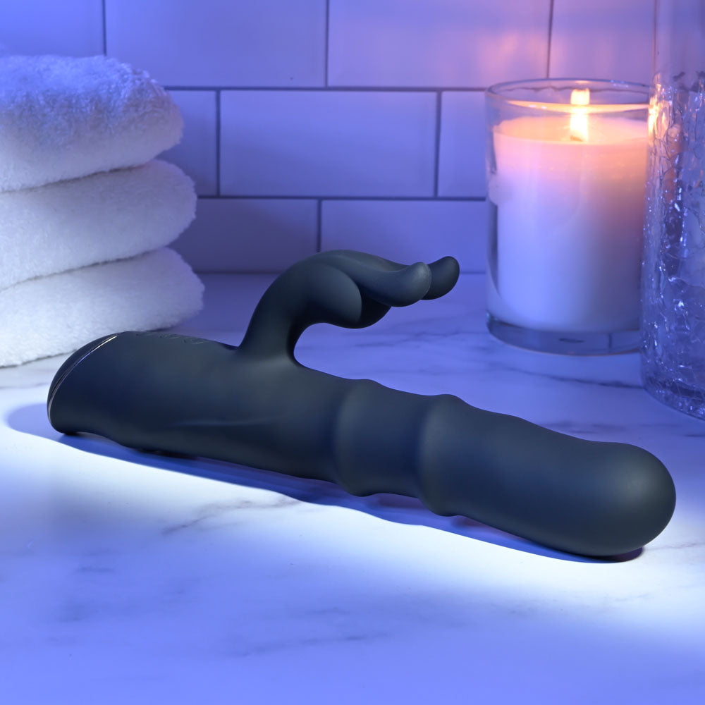 Evolved RINGMASTER -  23.1 cm USB Rechargeable Rabbit Vibrator on a marble counter with candles and towels.