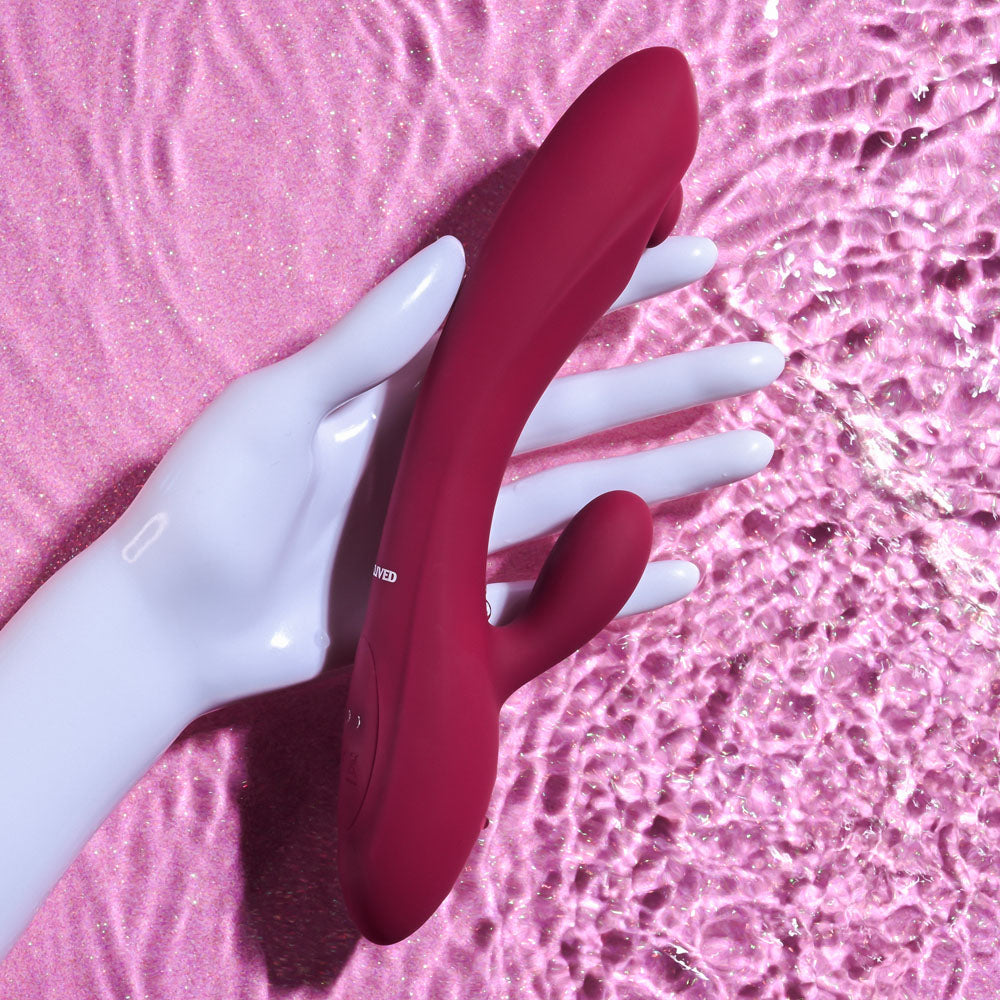 Evolved JAMMIN' G - Burgundy 20.1 cm USB Rechargeable Rabbit Vibrator on a pink background, designed for ultimate pleasure.