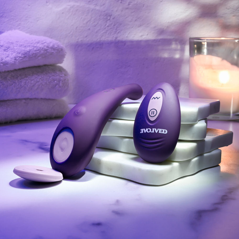 Evolved PANTY PARTY USB rechargeable panty vibrator with remote control on a marble surface.