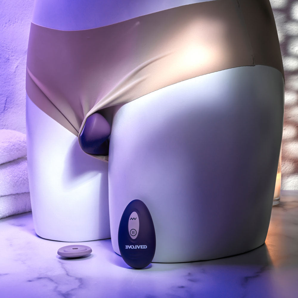 Evolved PANTY PARTY -  USB Rechargeable Panty Vibrator with Remote Control on display with body form.