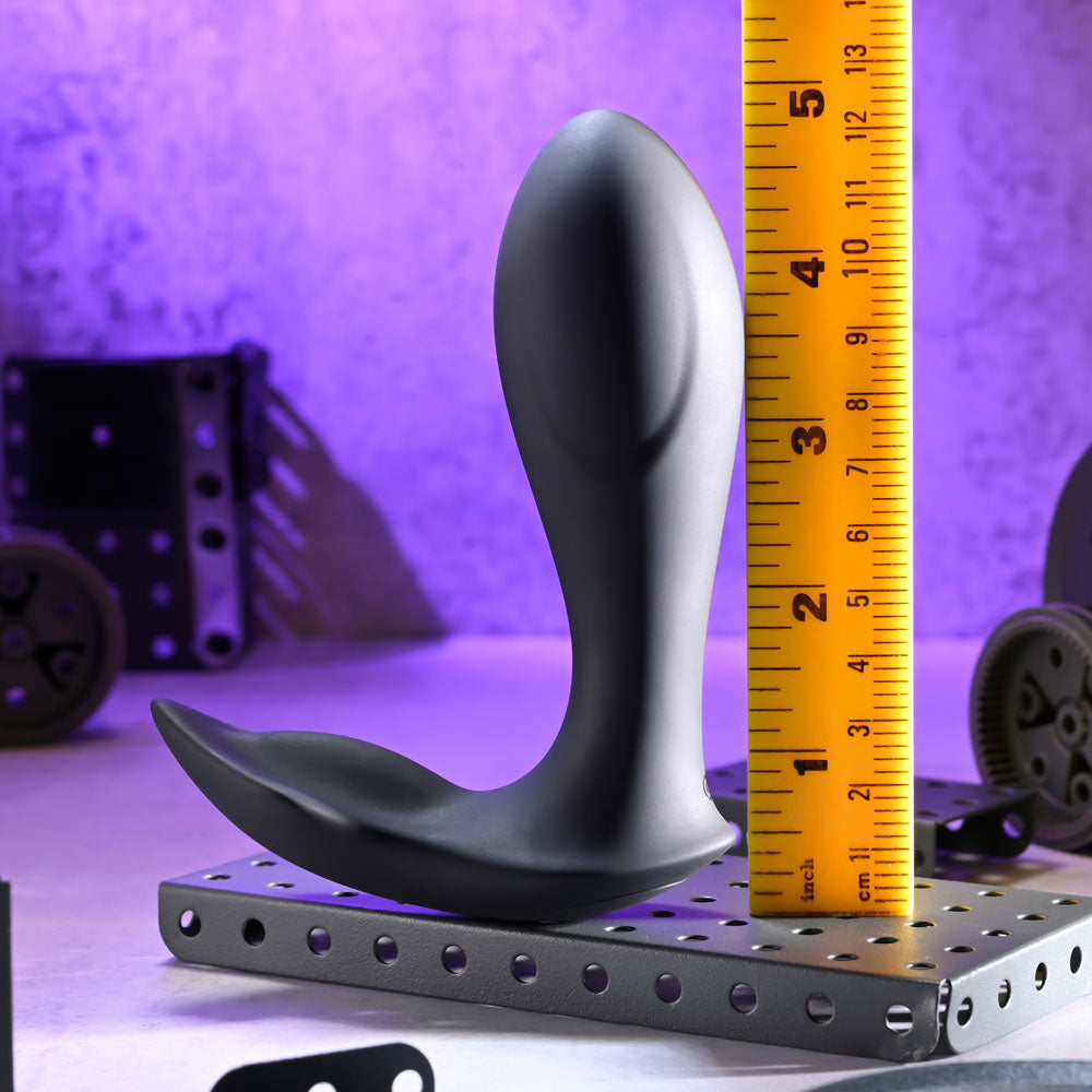 Evolved TAKE ME OUT - USB Rechargeable Wearable Vibrator with Remote Control next to ruler for size comparison.
