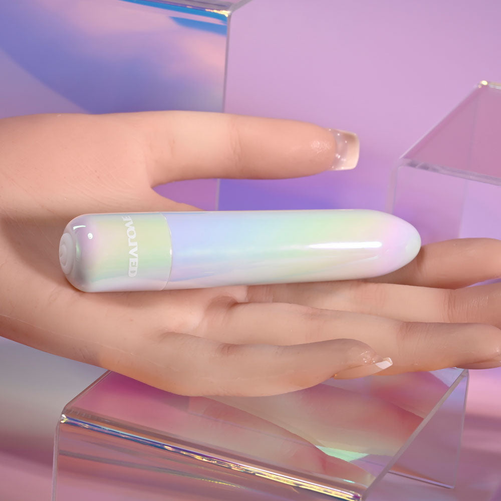 Evolved EASY DOES IT - Pearlescent 10 cm USB Rechargeable Bullet on a hand with an iridescent background.