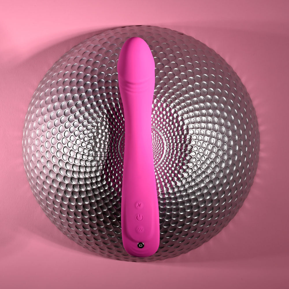 Evolved SUGAR RUSH - 21.6 cm USB Rechargeable Vibrator on a textured silver surface, highlighting its design.