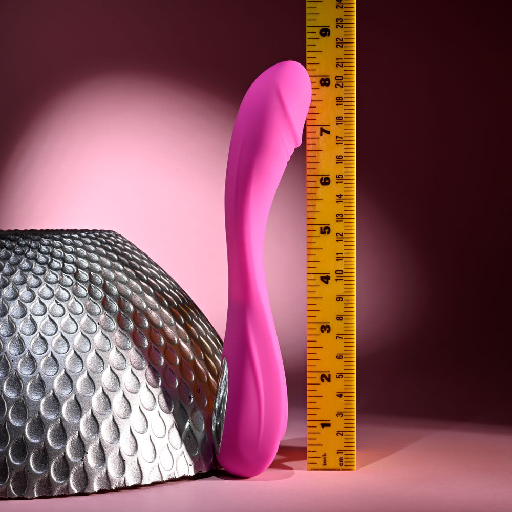 Evolved SUGAR RUSH - 21.6 cm USB Rechargeable Vibrator beside a ruler for size reference.