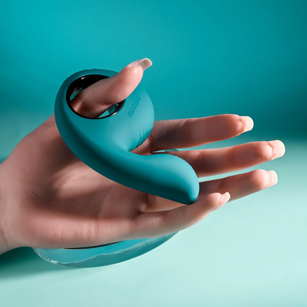 Evolved THUMBS UP - USB Rechargeable Stimulator held in a hand, showcasing its curved design and textured features for pleasure.